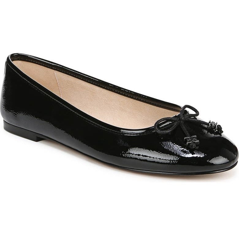 Black patent leather ballet flat with a bow and low heel, suitable for casual or formal occasions