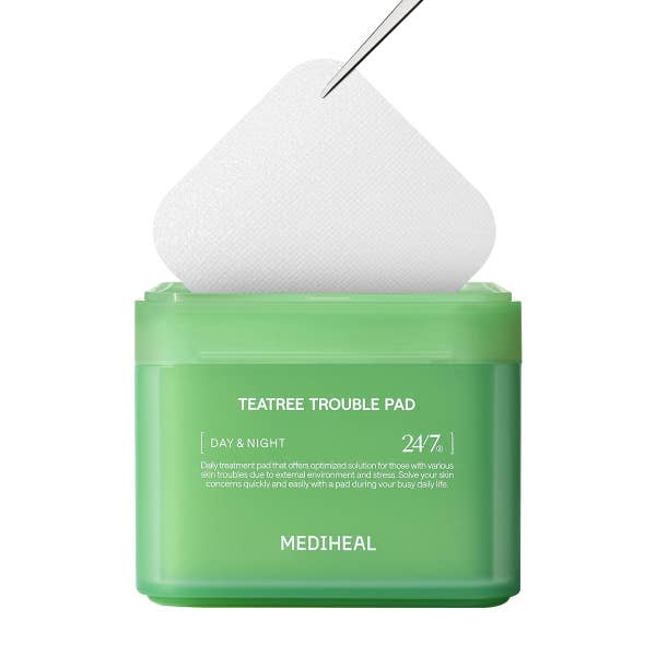 Mediheal Tea Tree Trouble Pad container with a pad partially removed by a tweezer. Text mentions day and night skincare