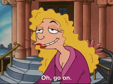 Animated character with curly hair smiles and says, &quot;Oh, go on.&quot;