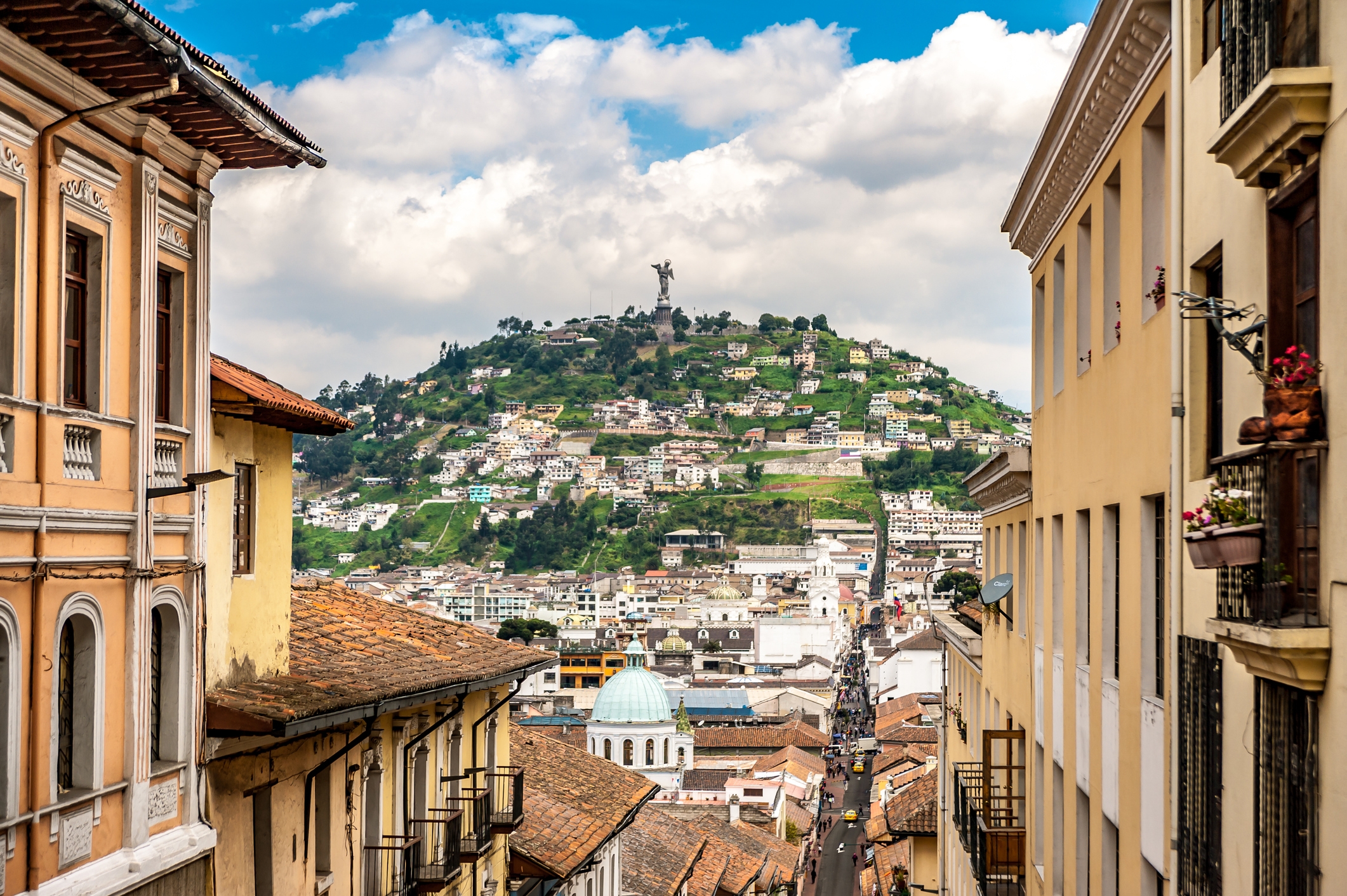 Cityscape of Quito, Ecuador with El Panecillo hill and the Virgin of Quito statue in the background