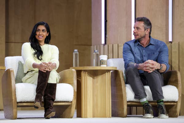 Monica Padman and Dax Shepard speak onstage