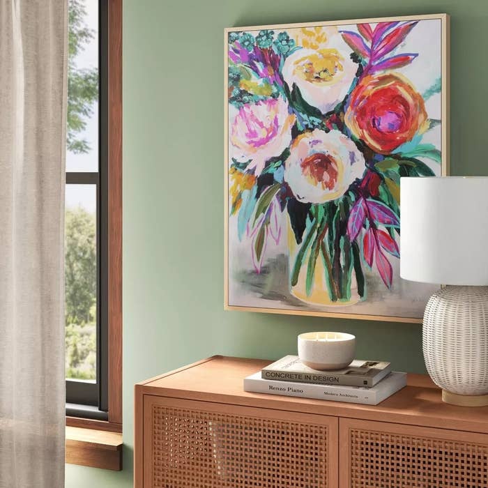 Social media trends Viral content Trending hashtags Social media updates Trending memes and videos A vibrant floral painting above a wooden cabinet.