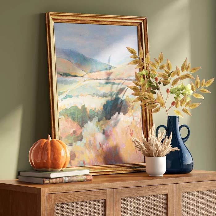 Social media trends Viral content Trending hashtags Social media updates Trending memes and videos Framed pastel landscape art on a cabinet.