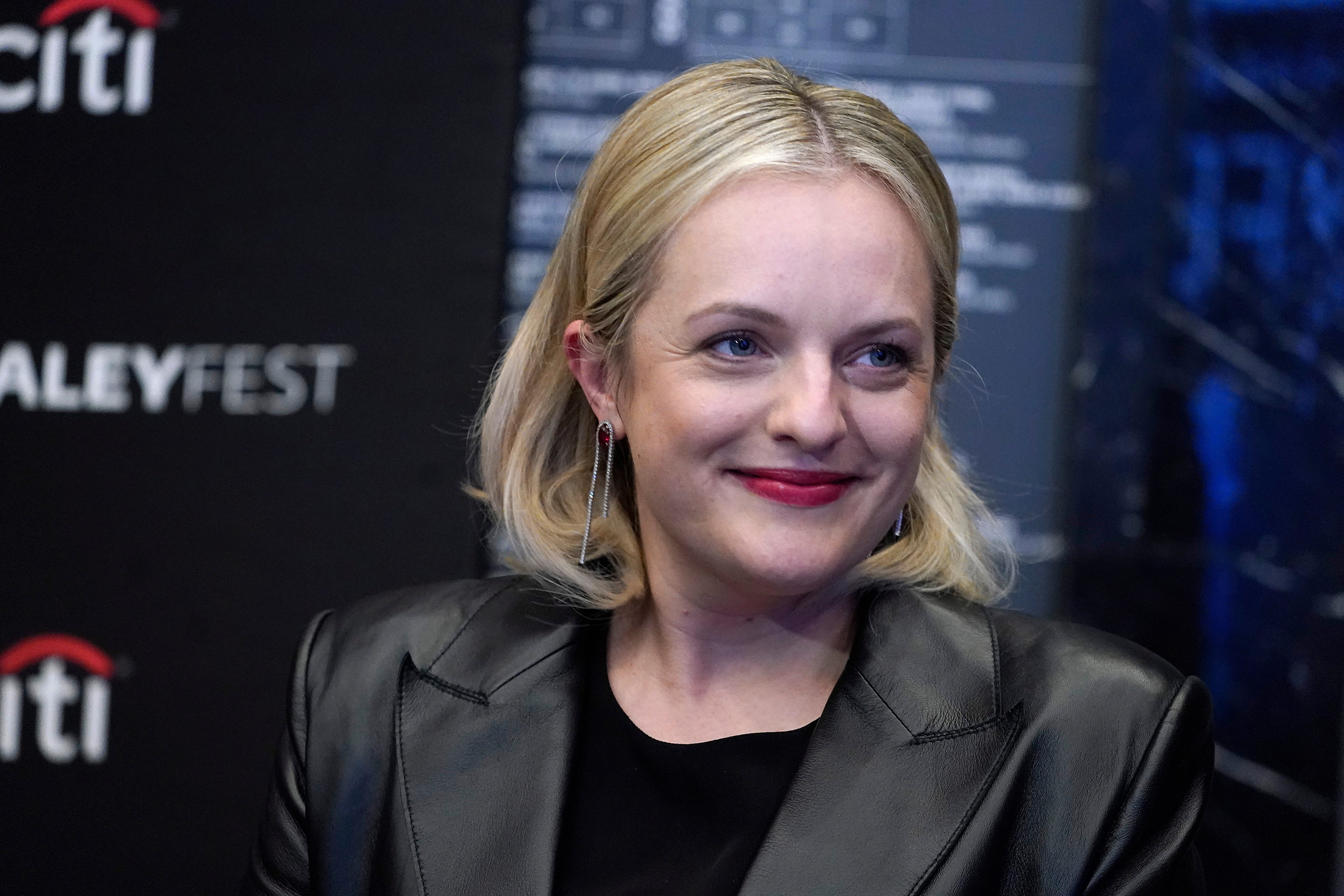 Elisabeth Moss at an event, smiling