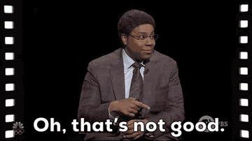 Person in a suit and glasses sits, pointing to the side, with text overlay: &quot;Oh, that's not good.&quot;
