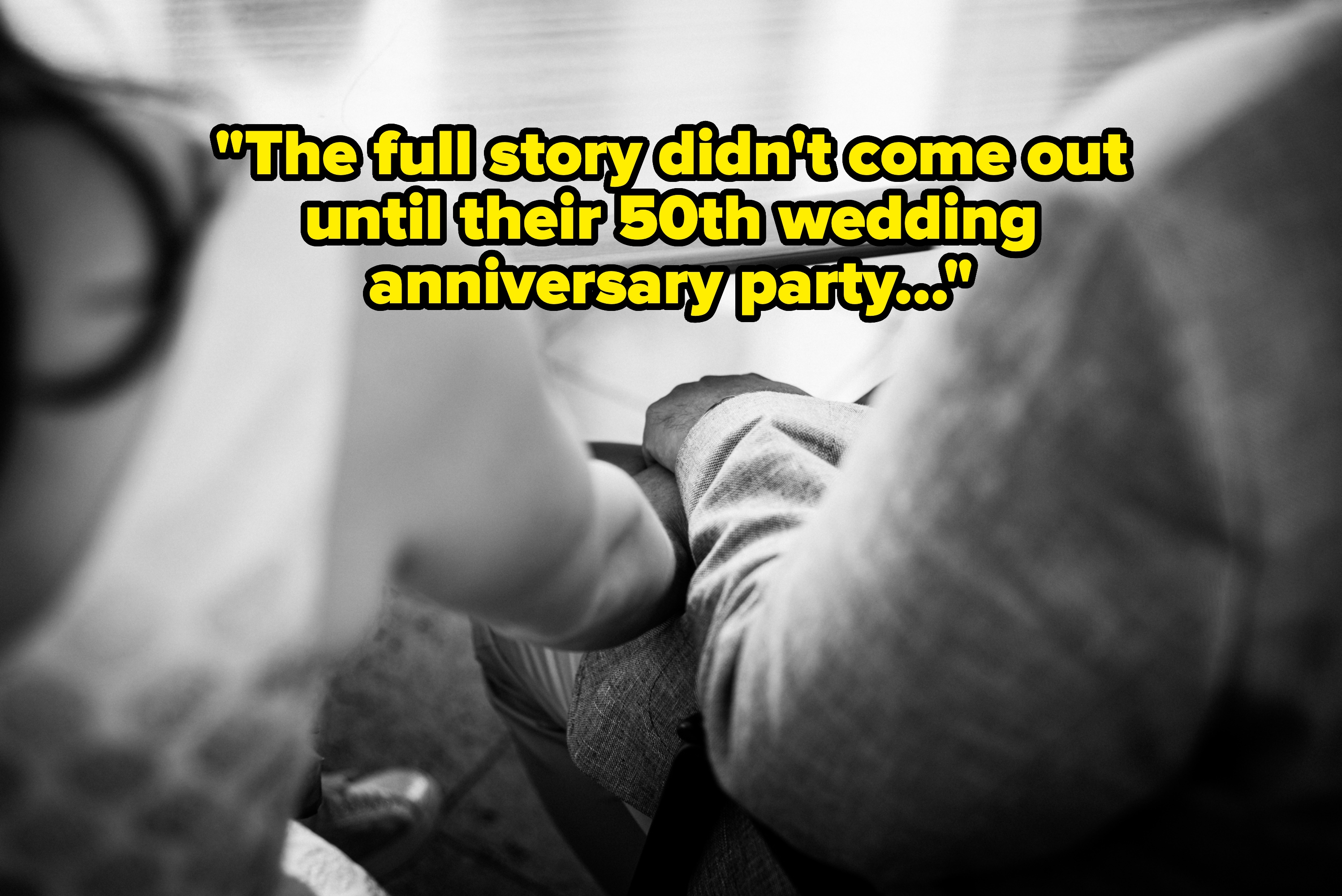 Two people hold hands tenderly, seen from behind in an intimate moment, suggesting a close relationship or supportive connection