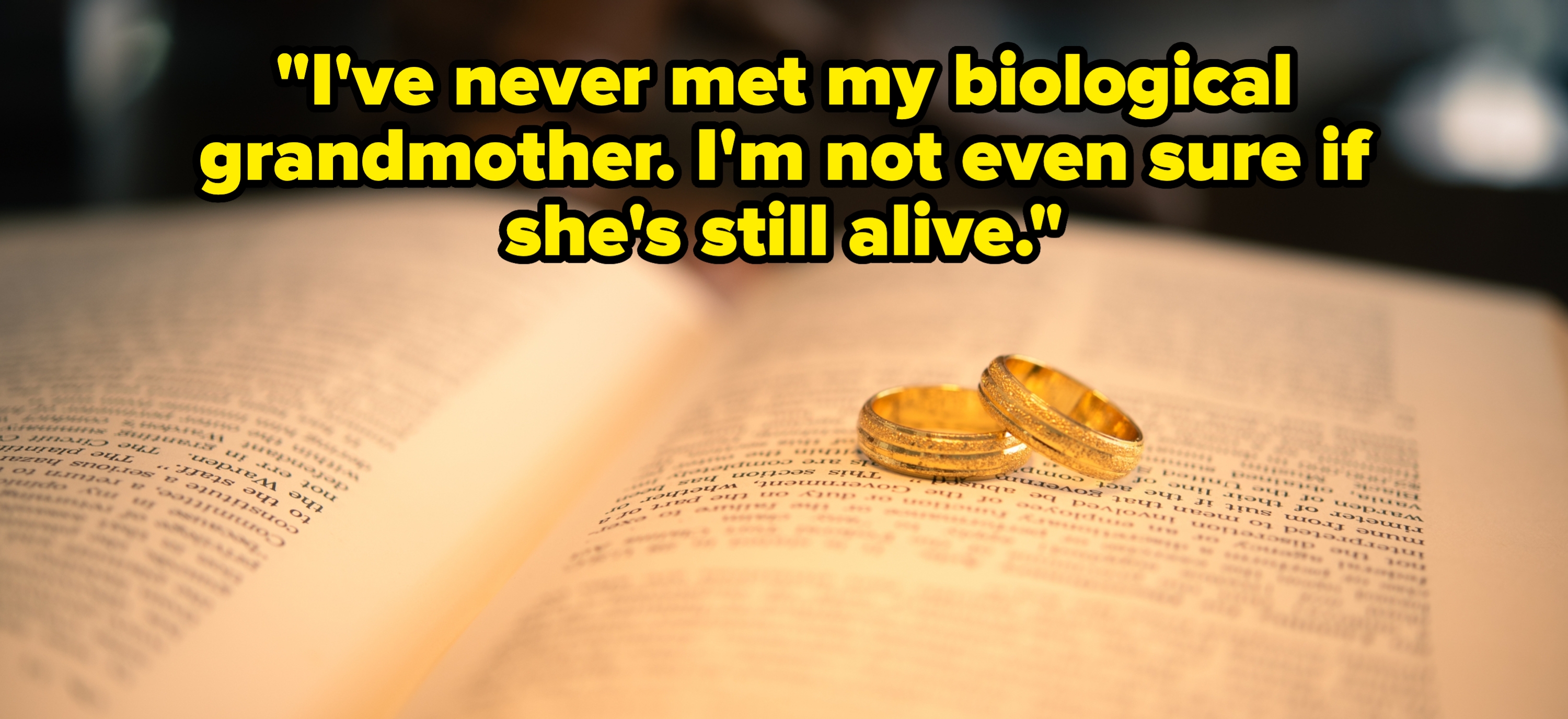 Two gold wedding rings rest on an open book, symbolizing union and commitment, with the book suggesting a foundation of knowledge or tradition