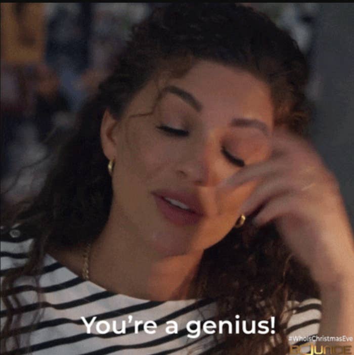 A woman in a striped top smiles and touches her hair, with text saying, "You're a genius!"