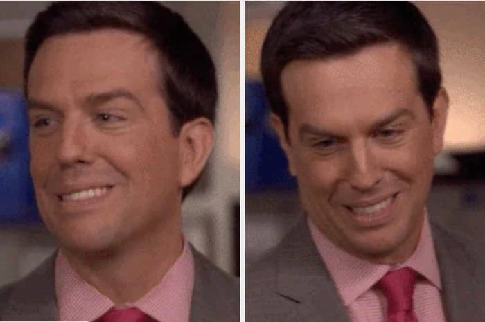Man in a suit and tie smirking on the left, looking down with a slight smile on the right