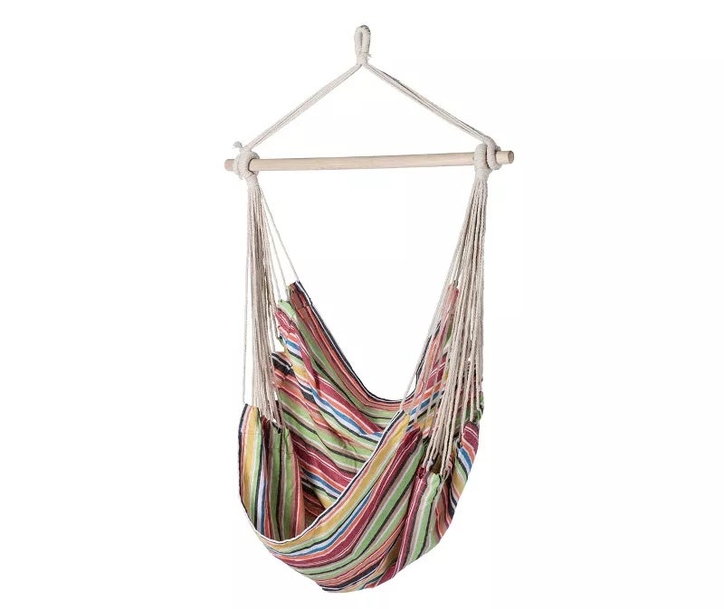 Striped hanging hammock chair with a wooden bar and rope support, ideal for comfortable lounging