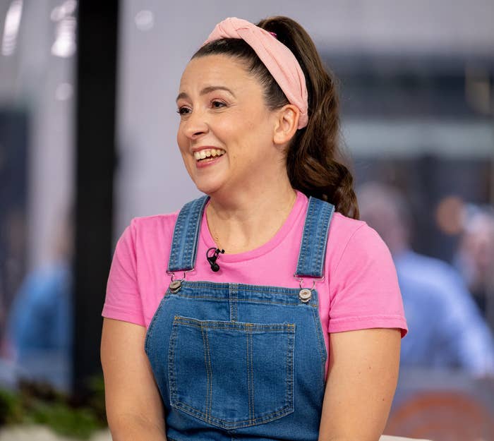 Ms. Rachel smiling on a talk show set