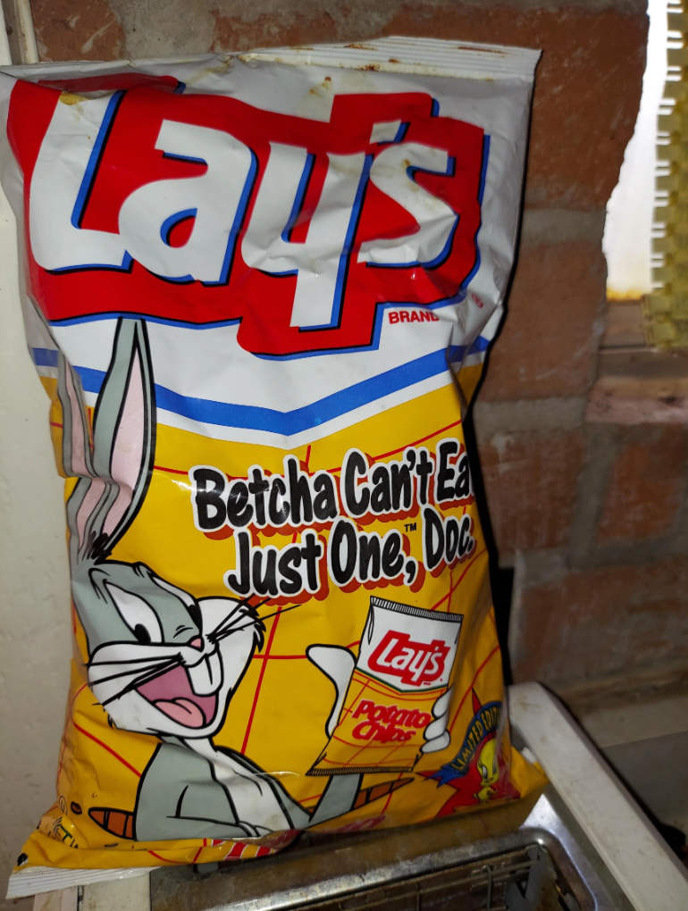 Bag of Lay's potato chips featuring Bugs Bunny holding a chip, with the slogan "Betcha Can't Eat Just One."