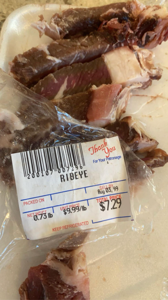 Packaged ribeye meat with a price label showing weight, price per pound, total price $7.29, and packed/sell-by dates
