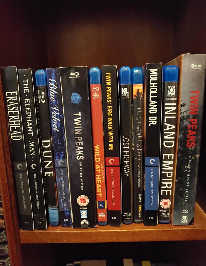 Collection of David Lynch movies on a shelf, including &quot;Eraserhead,&quot; &quot;Dune,&quot; &quot;Mulholland Dr.,&quot; and &quot;Twin Peaks&quot; series