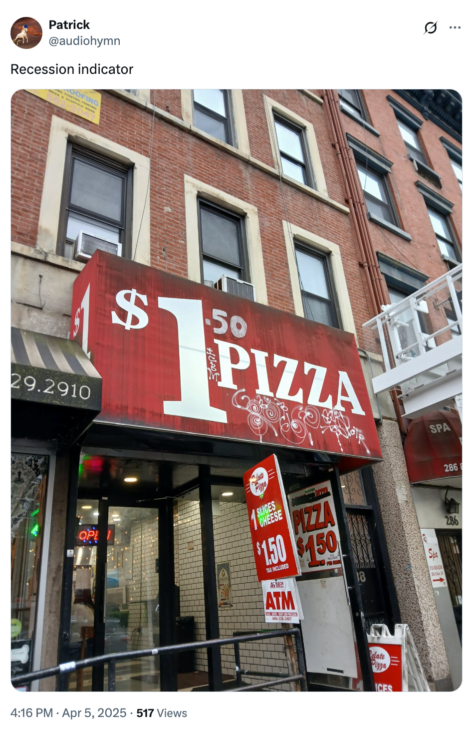 Storefront with $1.50 pizza sign, highlighting affordable pricing amid economic recession concerns