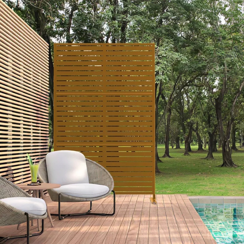 Outdoor patio with modern chairs, privacy screen, and pool. Trees in the background create a serene setting for relaxation or entertaining