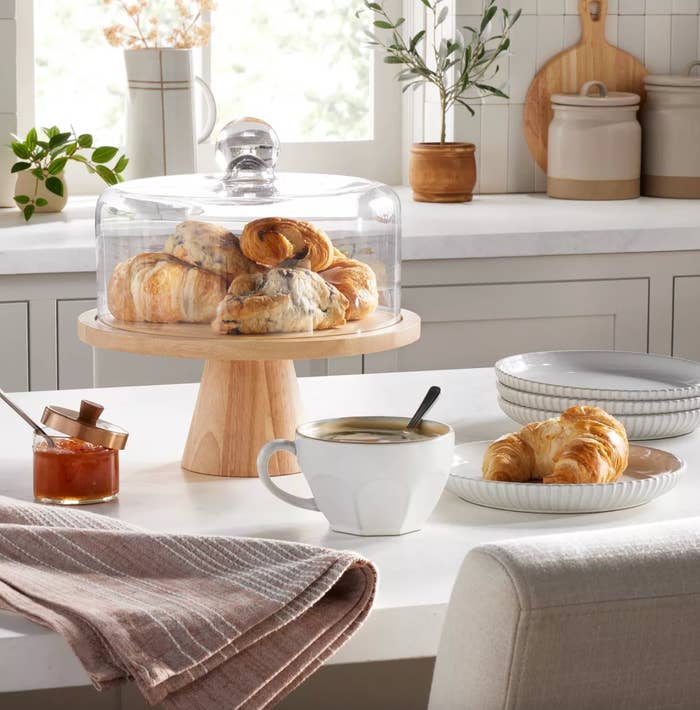 Pastries and a java  cupful  connected  a room  antagonistic  with jam and a cloth, nether  earthy  lighting