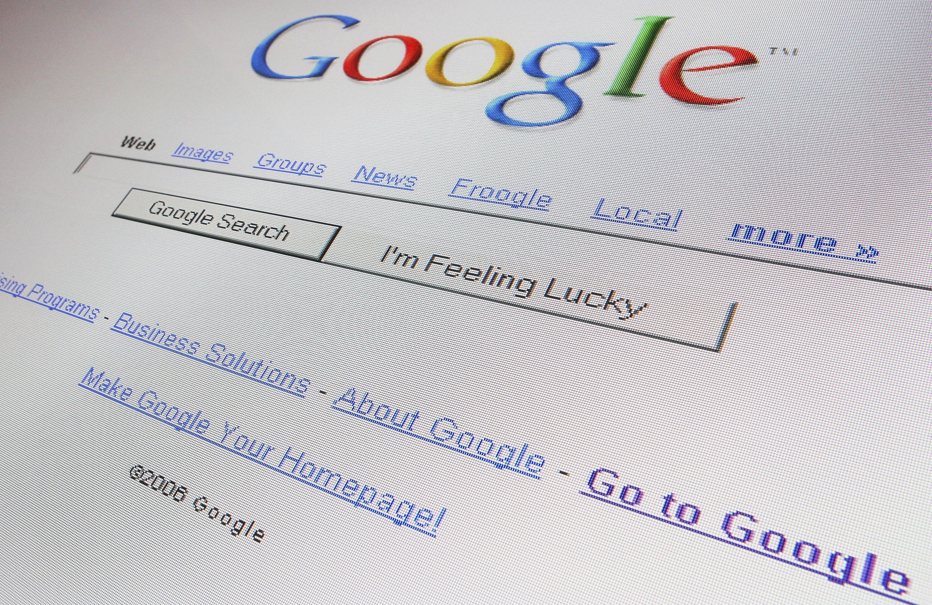 A close-up of a computer screen displaying the Google homepage with the search bar and navigation links like &quot;Images&quot; and &quot;Groups.&quot;