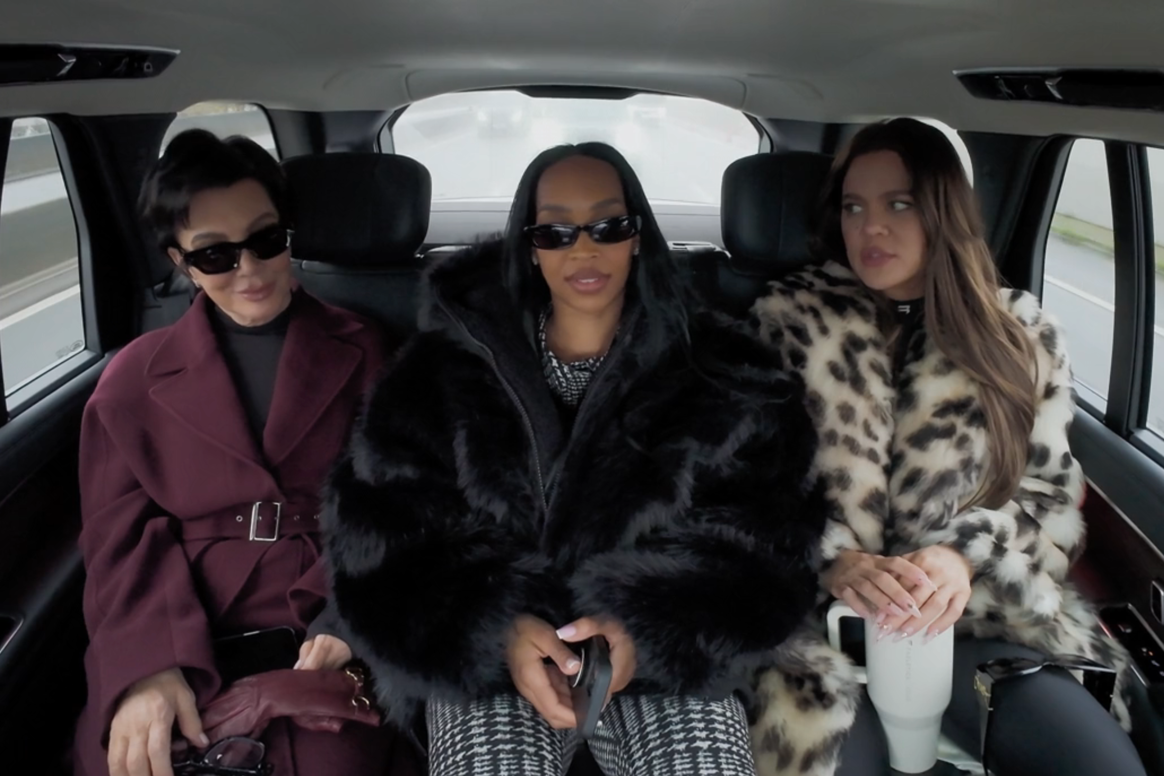 Kris Jenner, Malika Haqq, and Khloé Kardashian chatting in the back of a car