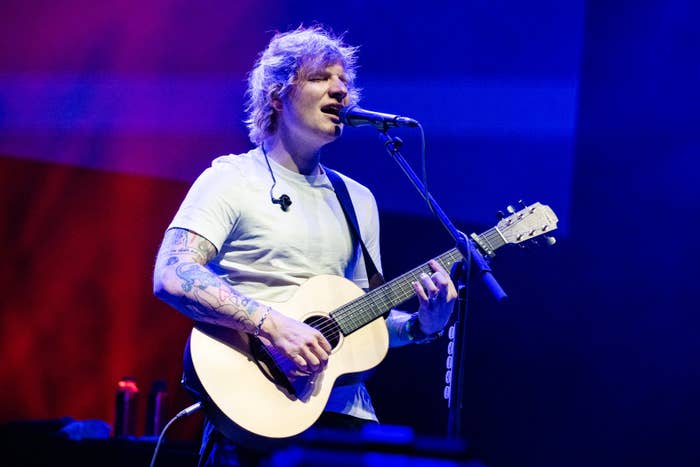 Ed Sheeran playing guitar and singing