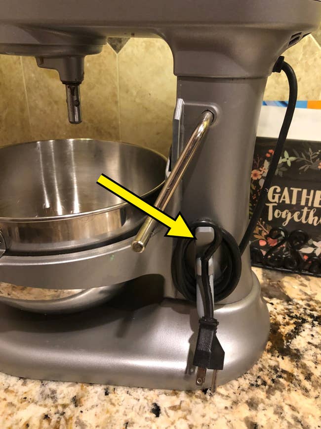 Stand mixer connected  room  antagonistic  with cord wrapped neatly connected  the side