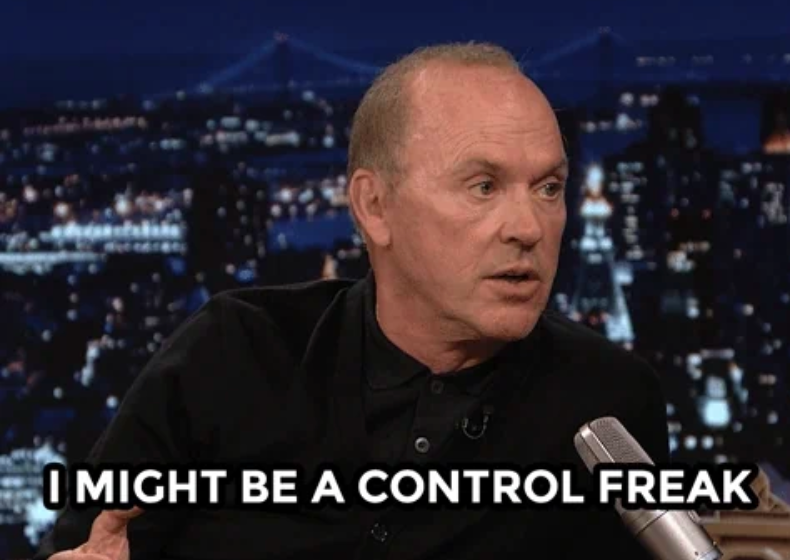 A person on a talk show set, speaking into a microphone. Text on the image reads, "I might be a control freak."