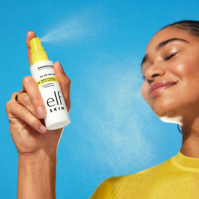 model utilizing the facial spray from e.l.f. Skin