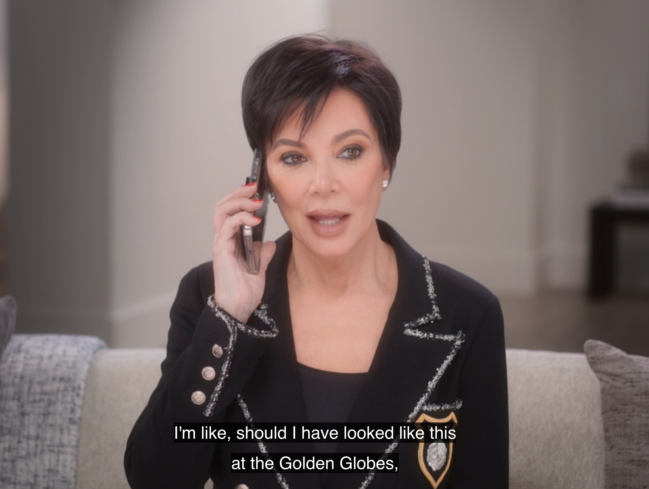 Kris Jenner talking on a phone. Caption: "I'm like, should I have looked like this at the Golden Globes."