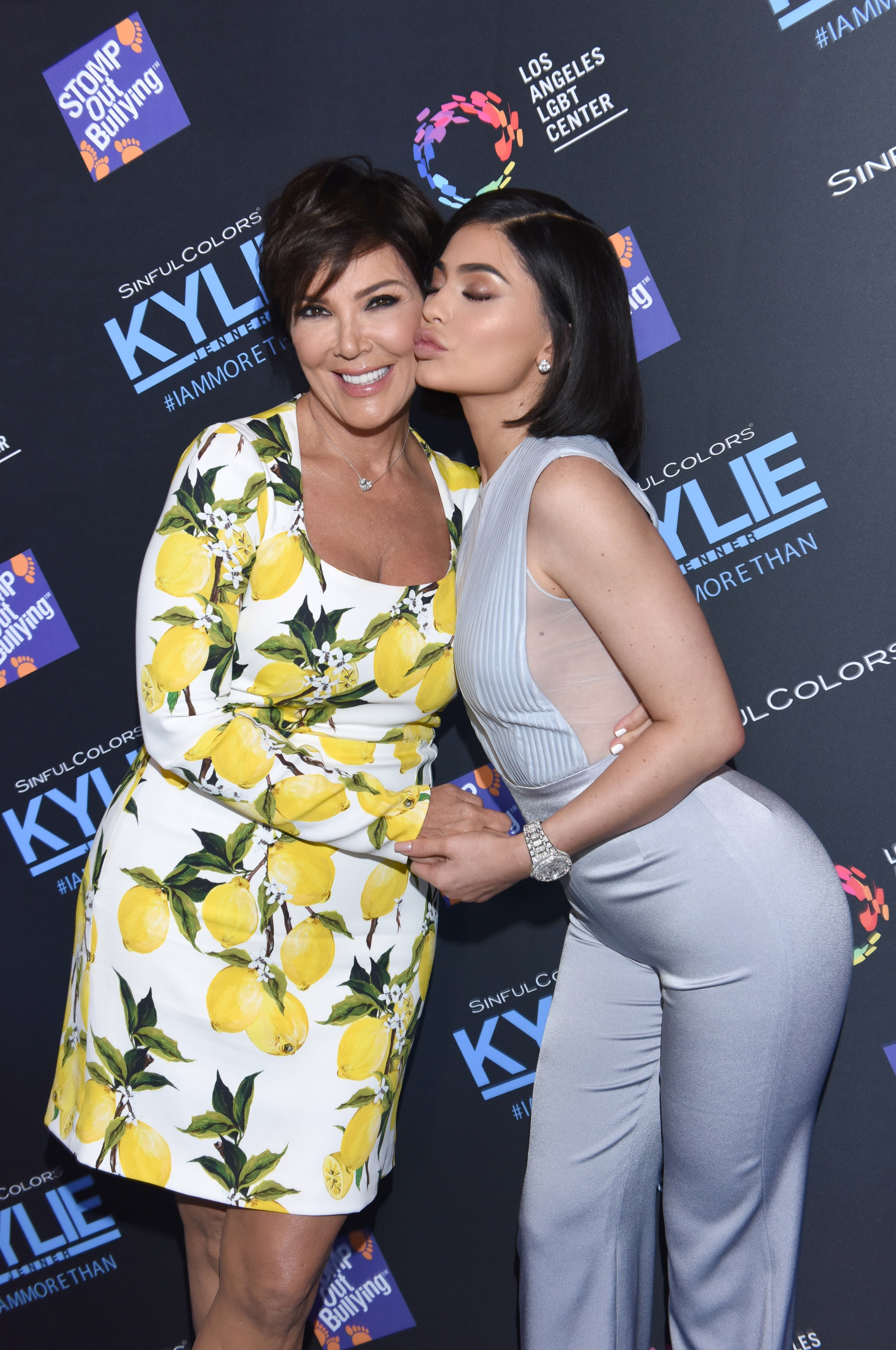 Kris Jenner and Kylie Jenner pose together at an event