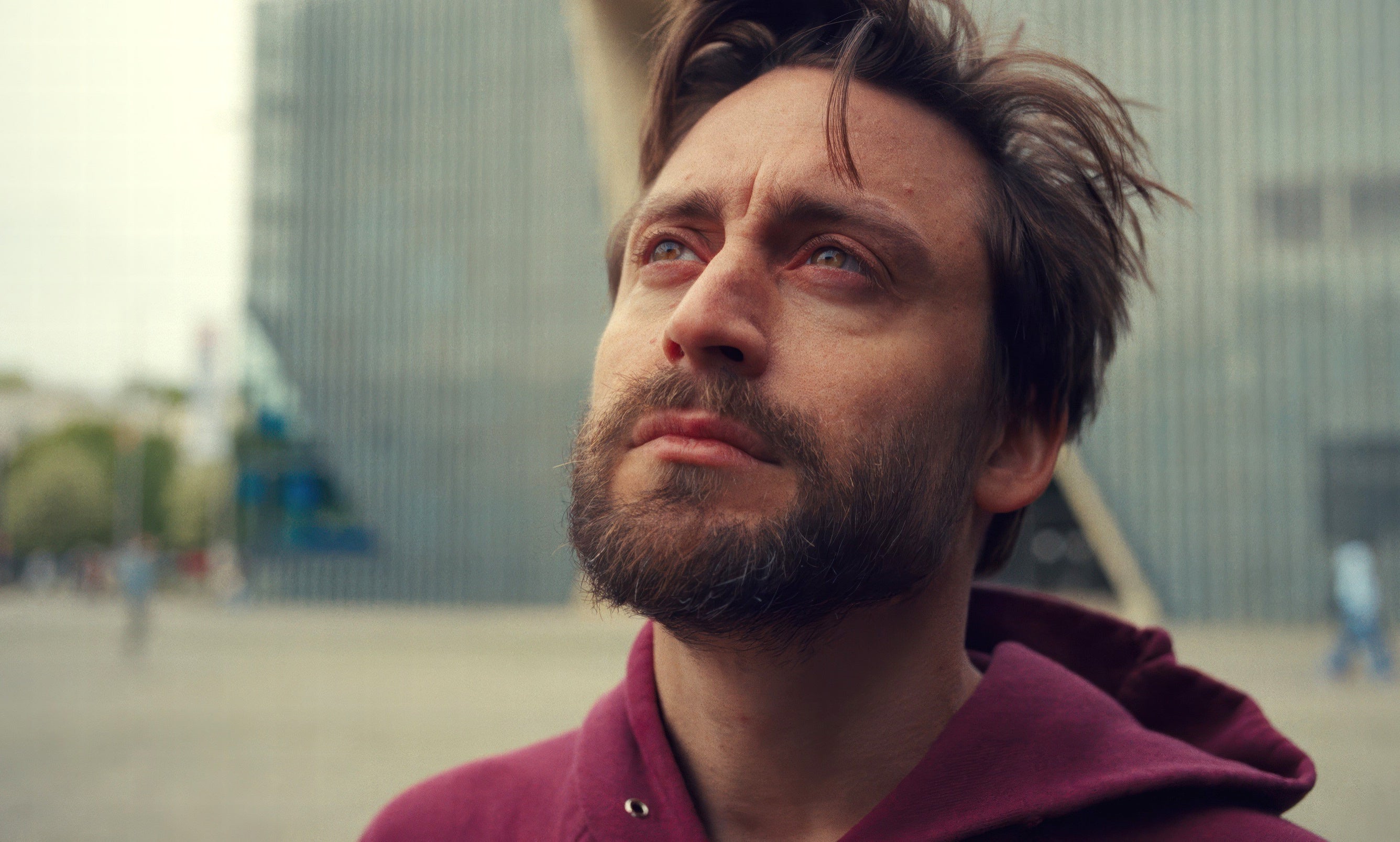 Kieran Culkin with a sad expression in "A Real Pain."