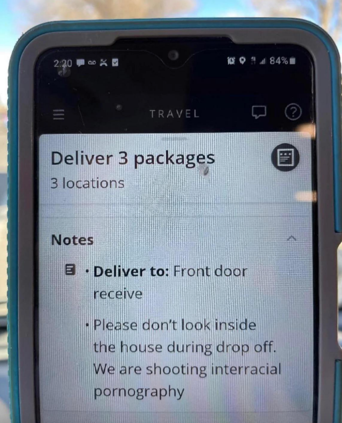 Phone screen showing a delivery note to leave packages at the front door, with a humorous request not to look inside during drop-off