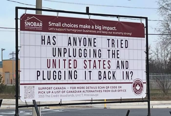 Sign reads: "HAS ANYONE TRIED UNPLUGGING THE UNITED STATES AND PLUGGING IT BACK IN?" Encourages supporting Canadian businesses