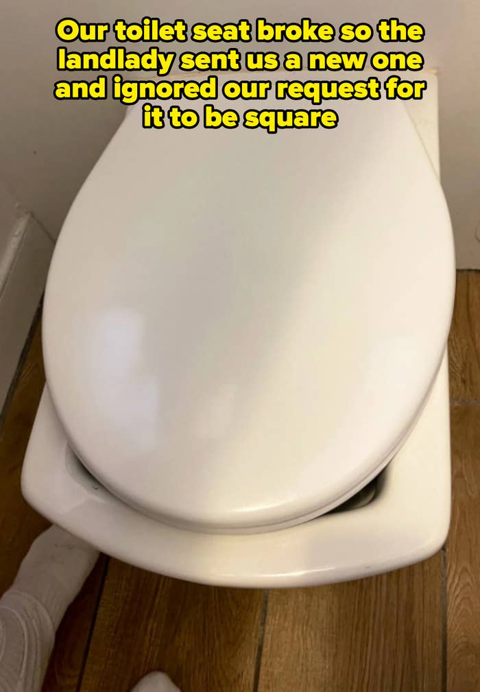 square-shaped toilet with oval lid captioned "Our toilet seat broke so the landlady sent us a new one and ignored our request for it to be square"