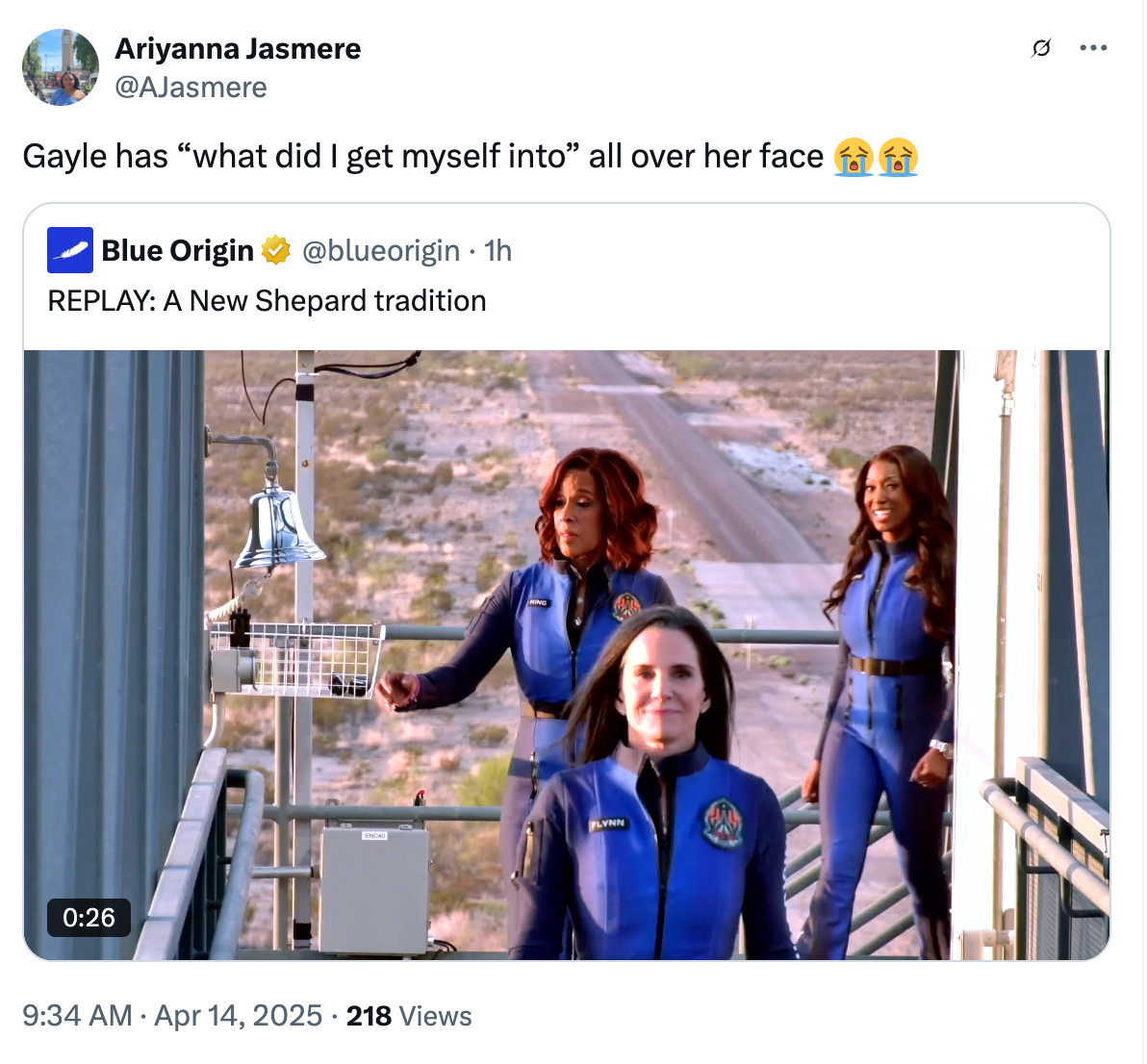 Three people in blue uniforms on a space facility staircase, with a caption mentioning "Gayle has 'what did I get myself into' all over her face."
