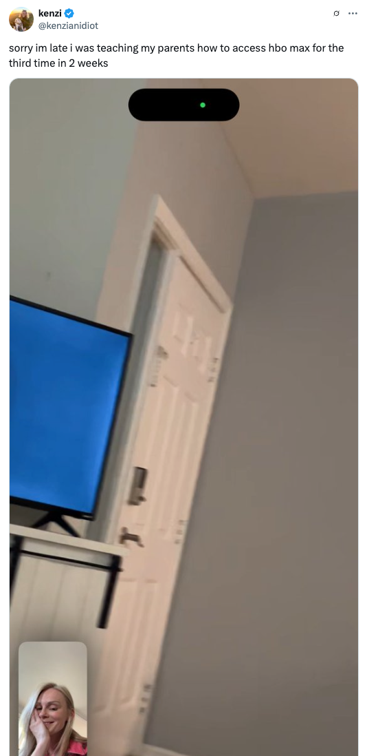 A person is on a video call, smiling. The tweet text humorously mentions teaching parents to use HBO Max multiple times in two weeks