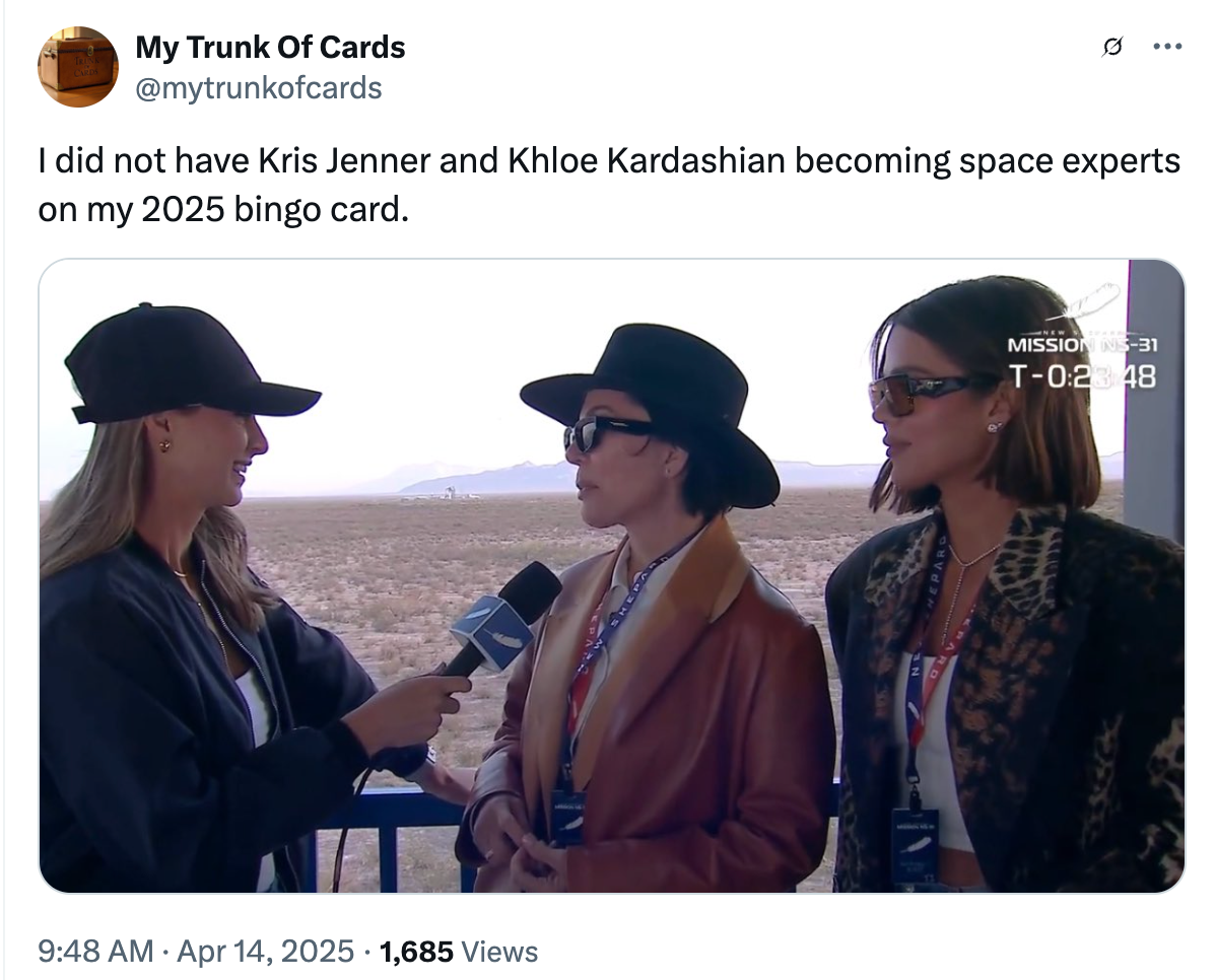 Two women being interviewed outdoors; wearing stylish jackets and sunglasses. Text above humorously references Kris Jenner and Khloe Kardashian as space experts