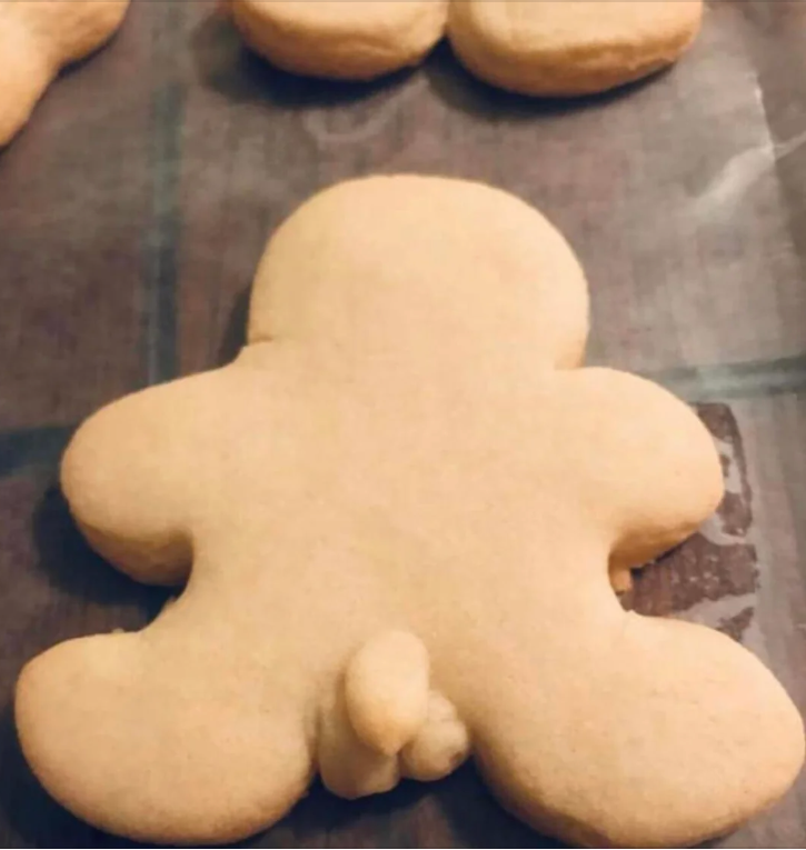 Gingerbread-style cookie shaped unintentionally humorously, baked for a family-friendly occasion