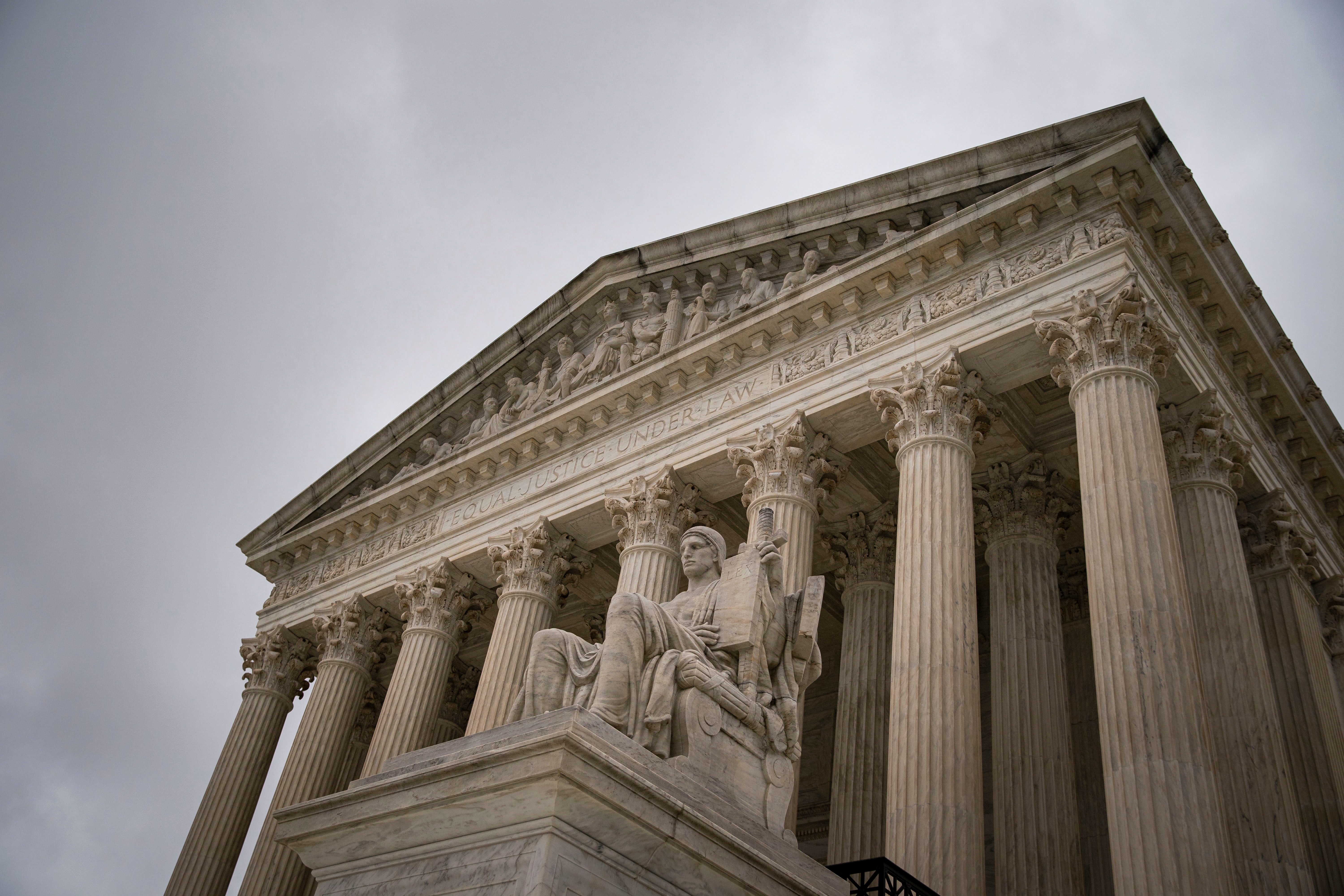 United States Supreme Court exterior with columns and statues