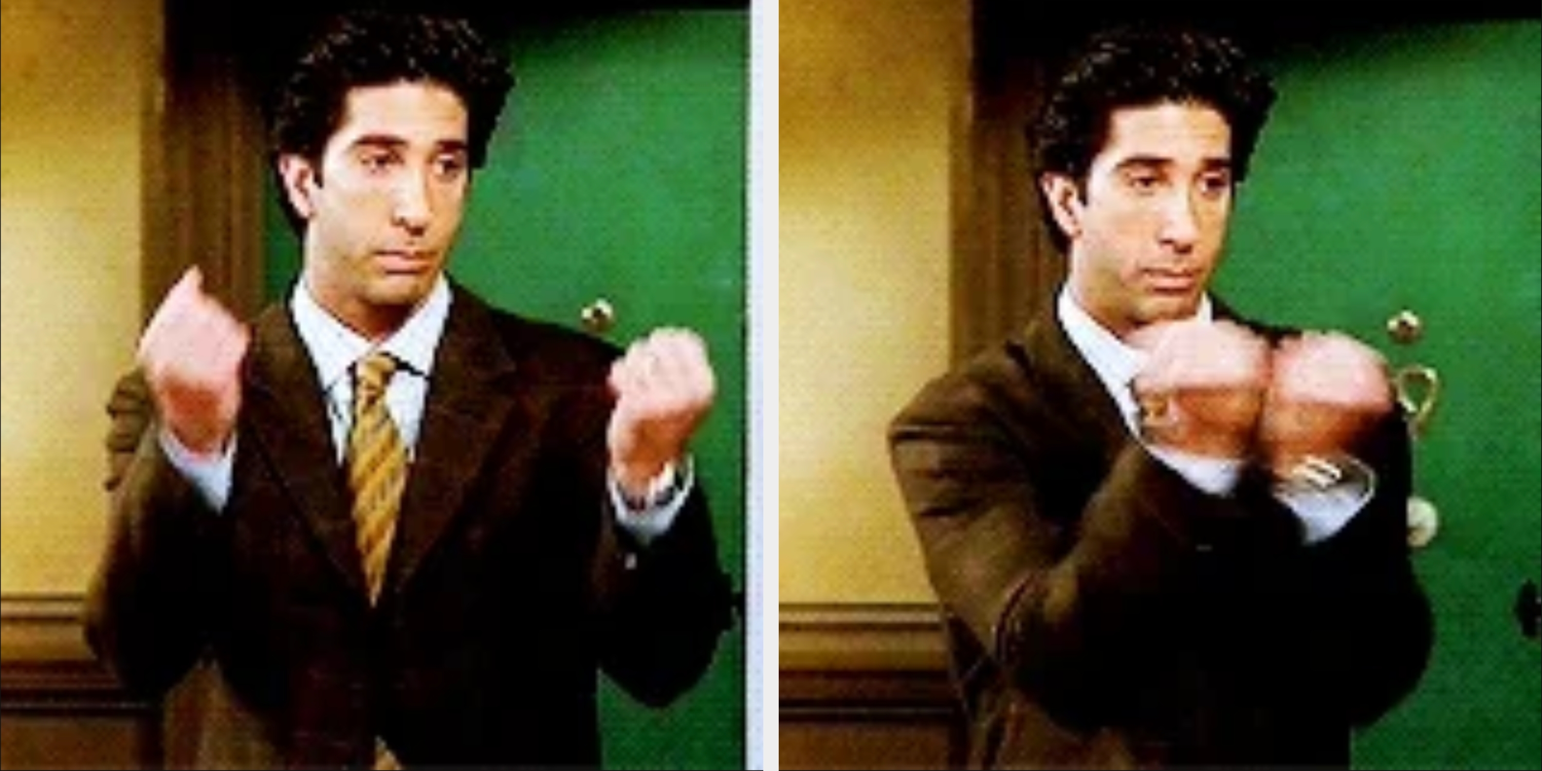 Person in a suit making a frustrated gesture with both hands raised, standing in a hallway