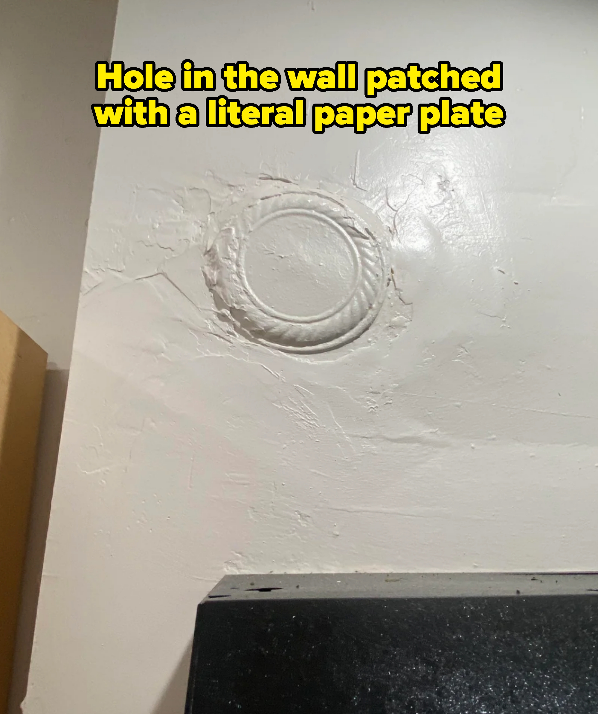 hole in the wall watched with paper plate, then painted over