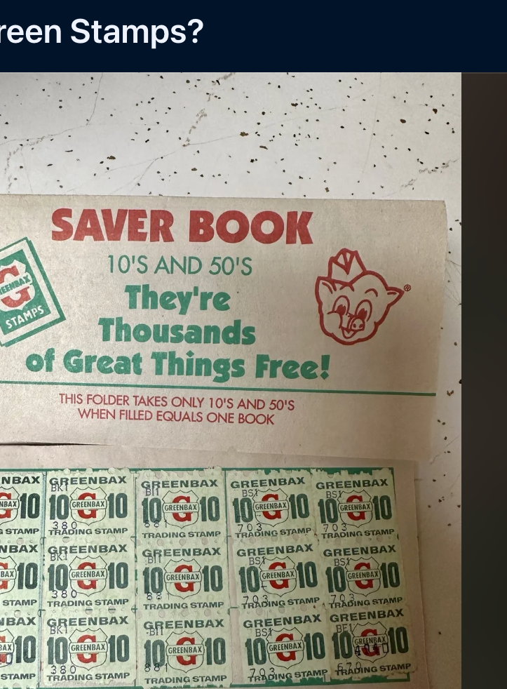 A person holds a Green Stamps Saver Book filled with stamps, reminding readers of the nostalgic savings program