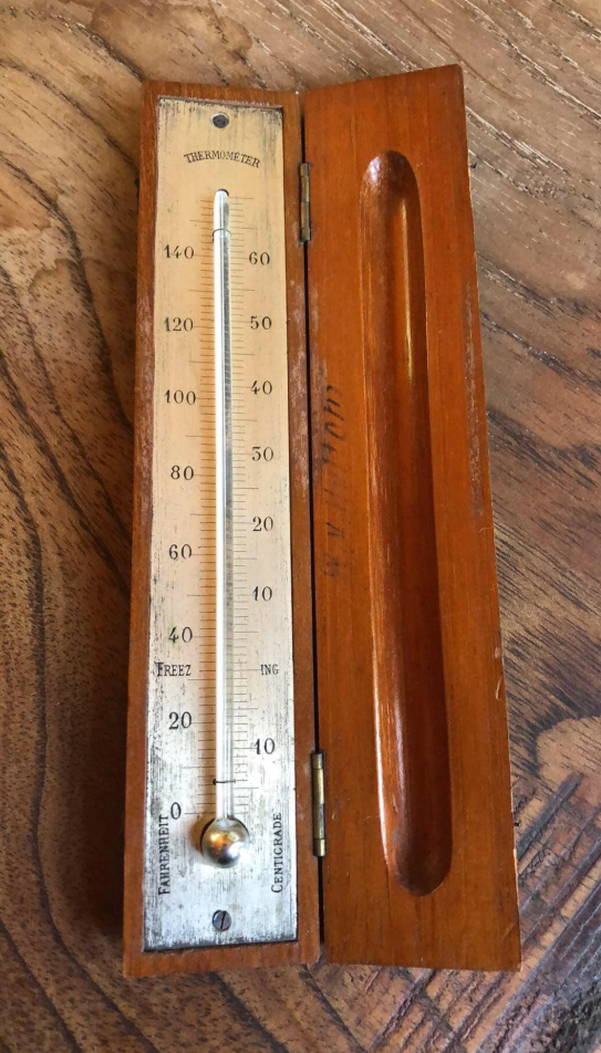 A Reddit post displays an antique mercury thermometer with a wooden case, described as belonging to the user's great-great-grandfather from 1895-1925