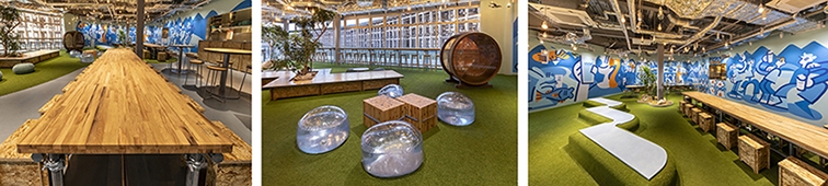 オフィスのインテリア: 木製テーブル、透明な椅子、壁に鮮やかなグラフィティアートがあります。リラックスした雰囲気。