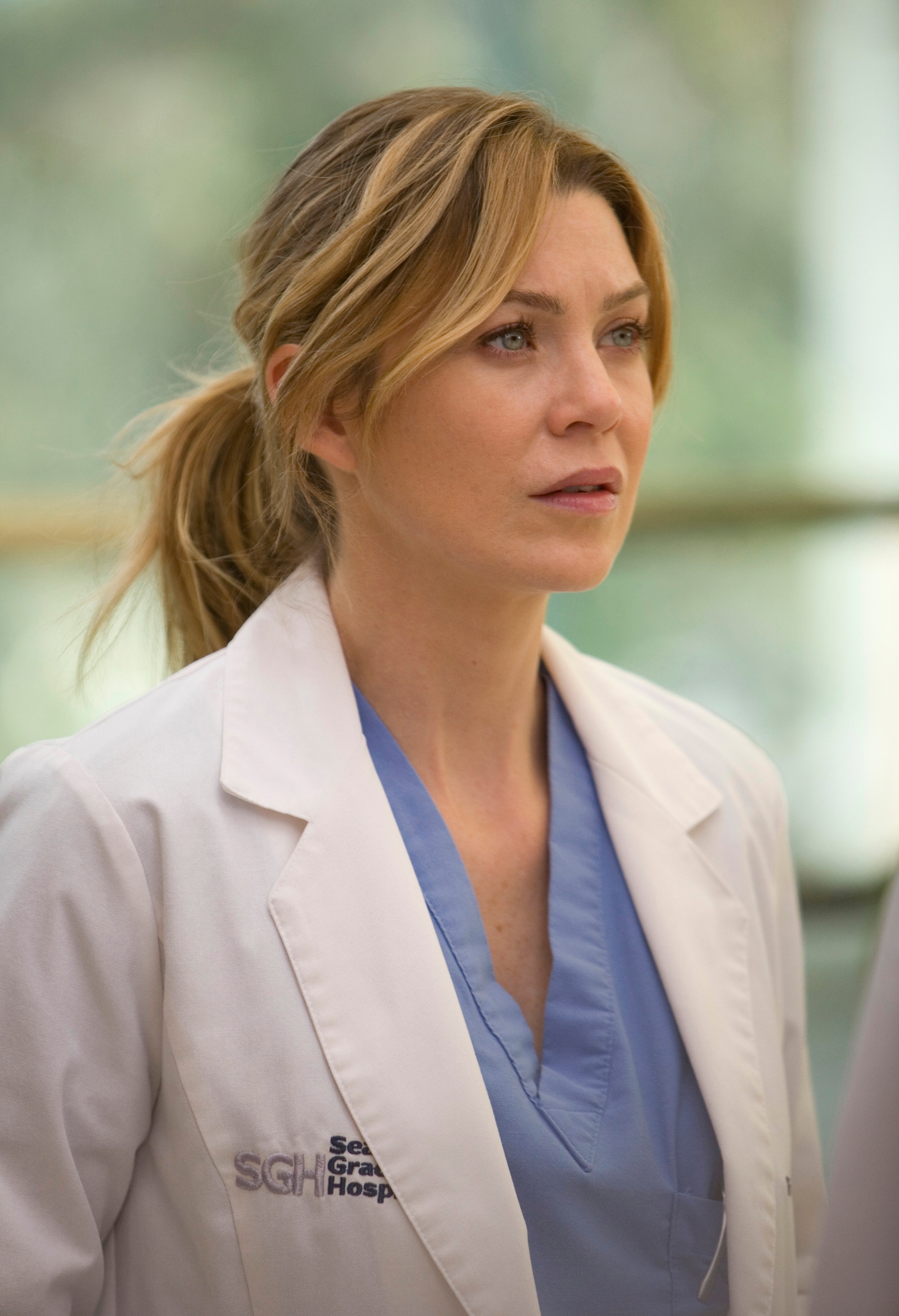 Ellen Pompeo as Meredith Grey in a medical setting on "Grey's Anatomy"