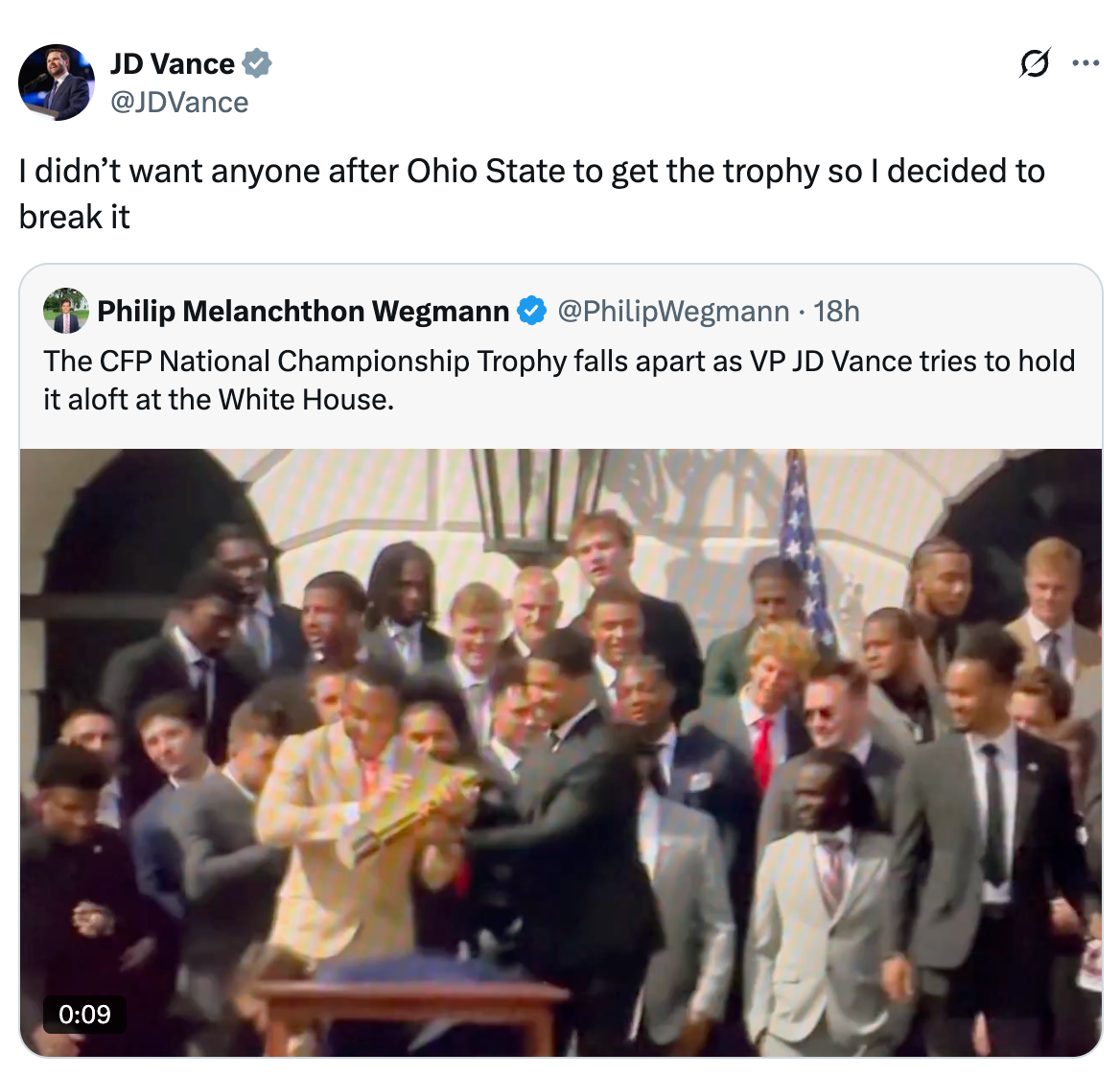 Man holds a broken trophy in a room with a crowd of people. Caption jokes about VP JD Vance breaking the championship trophy
