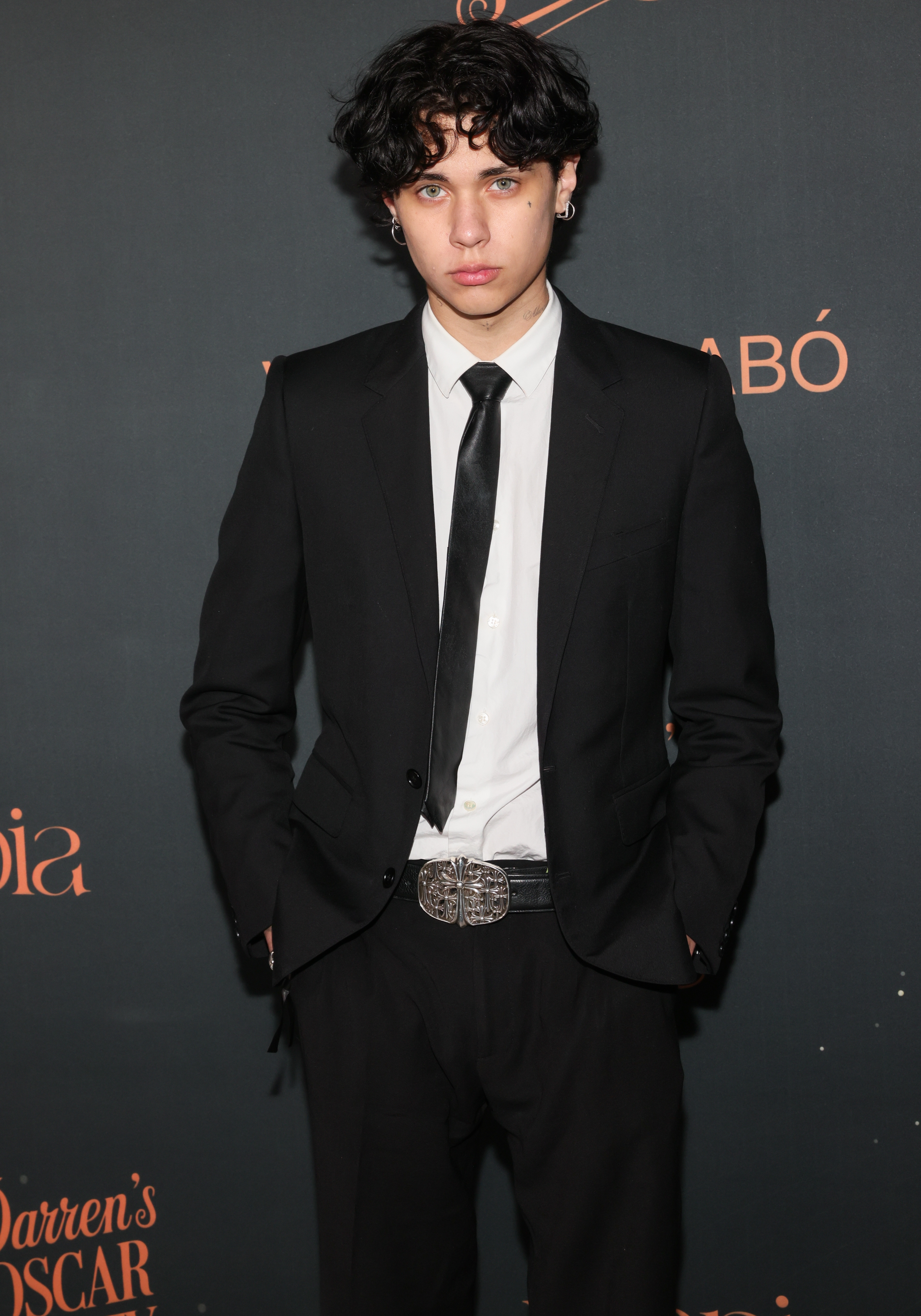 Landon Barker posing at a formal event