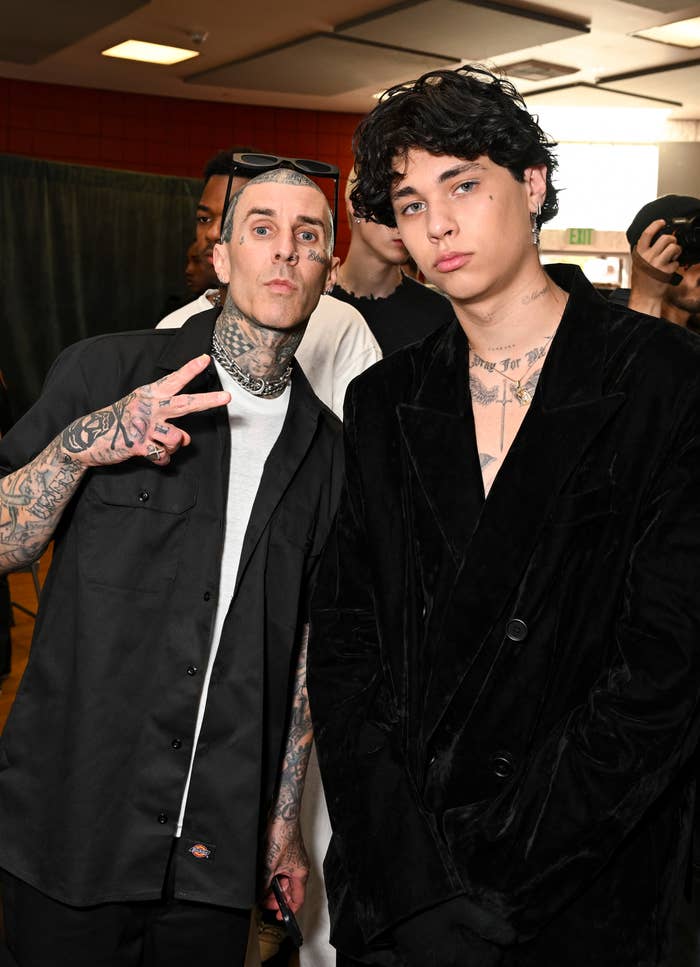 Travis Barker and Landon Barker posing at an event