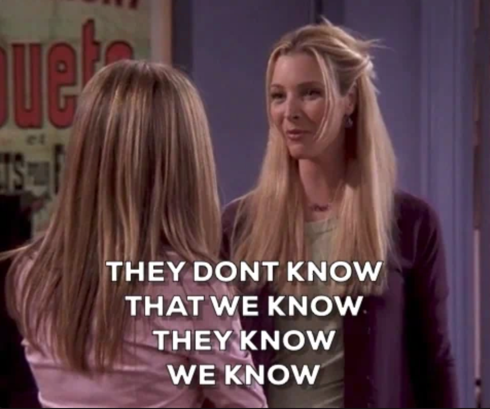 Two women talking in a scene from a TV show. Overlay text humorously says, "They don't know that we know they know we know."