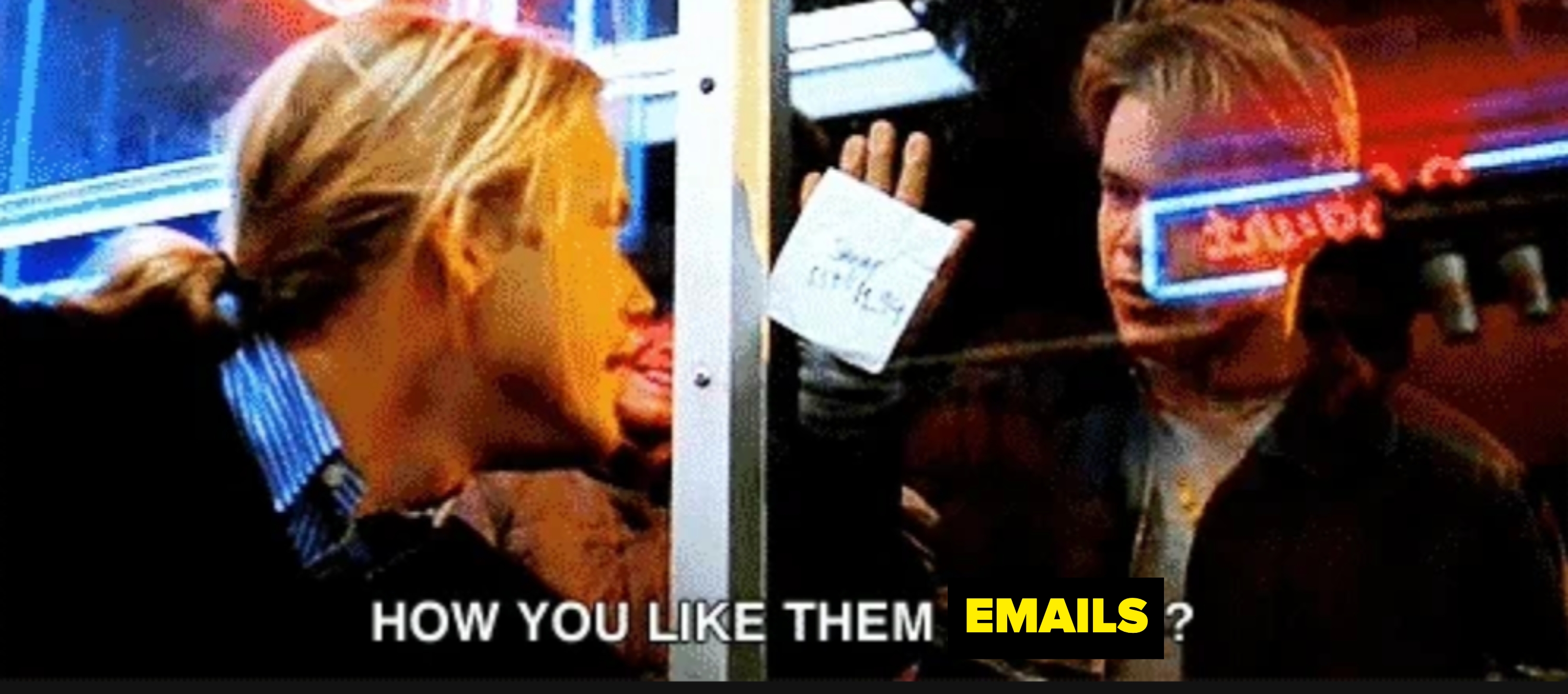 Scene from a movie with a person showing a note that says "How you like them apples?" through a glass door