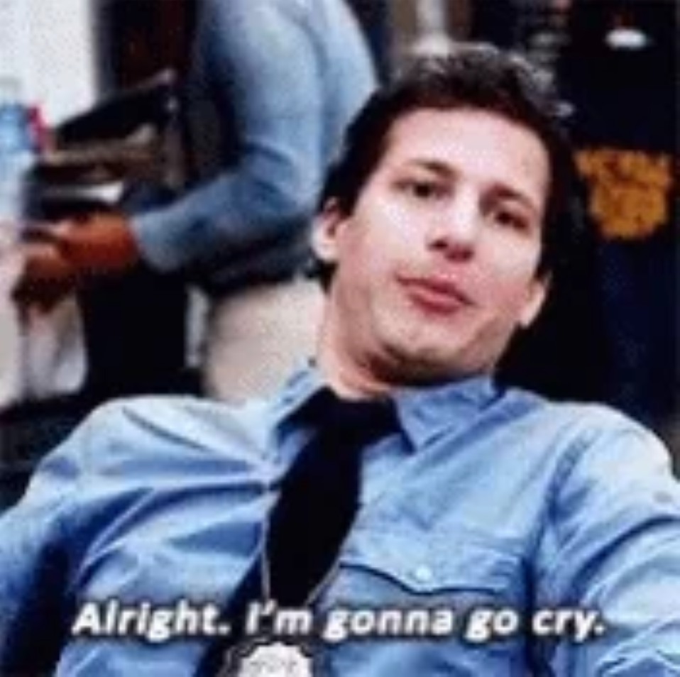 A person in an office setting leans back with a playful, resigned expression. Subtitles read, "Alright, I'm gonna go cry."